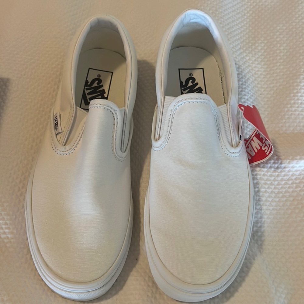 Vans white classic slip ons